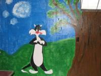 mural featuring cartoon cats including Loony Toons' Sylvester