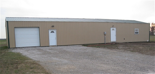Winter 2012 at 2510 South Elm Street, newly completed dog shelter addition seemlessly adjoins west of storage building