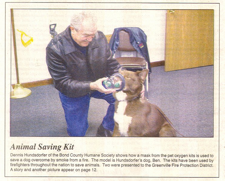 Dennis Hundsdorfer of BCHS and rescue dog Ben demonstrate how a pet oxygen mask works
