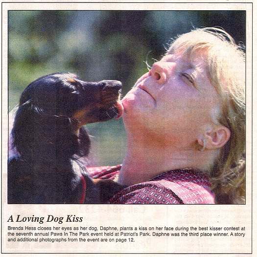 Cover Page Photo - Loving dog kisses during a contest event
